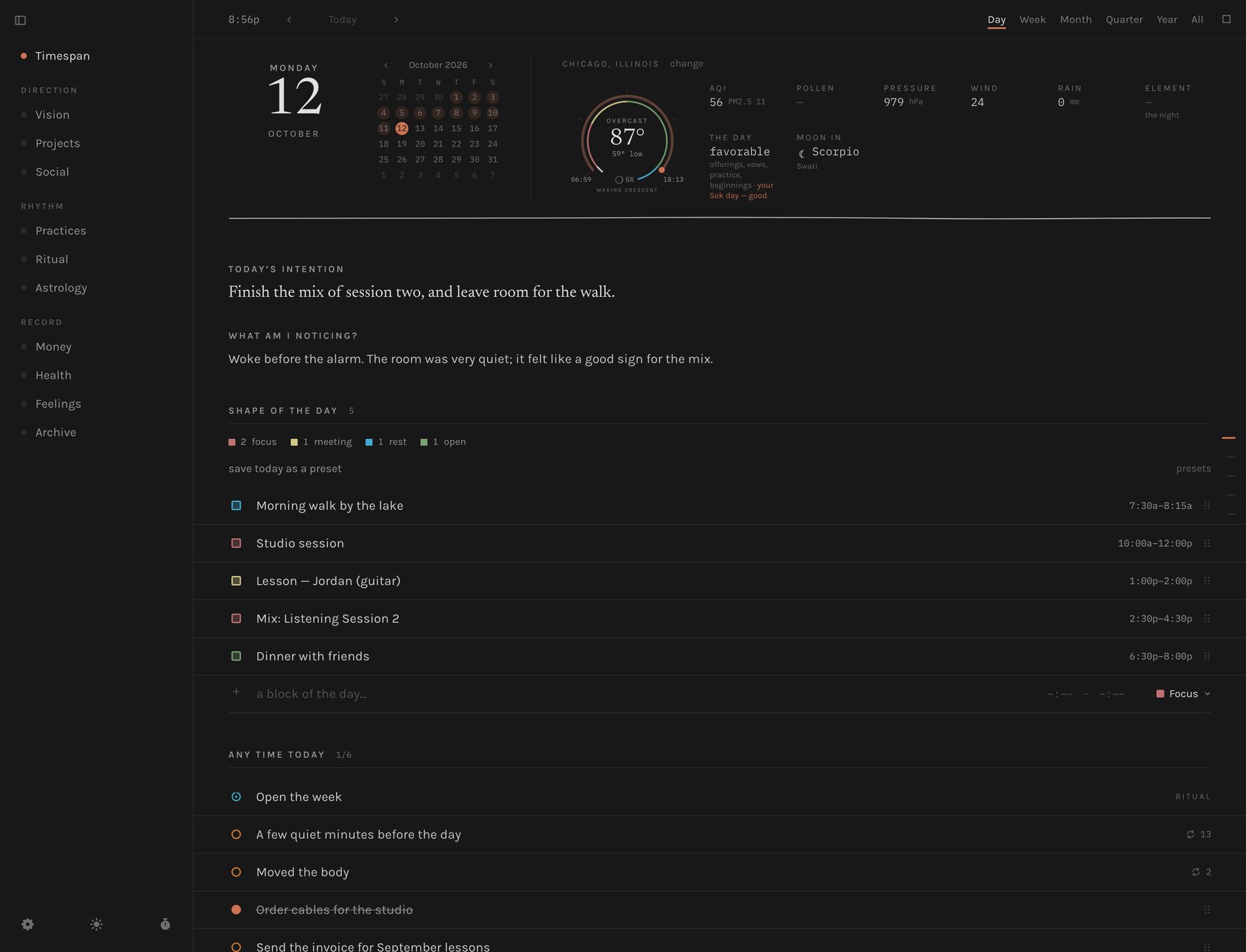 The day view at night: near-black background, light grey text, terracotta accents on today's date and the to-do rings
